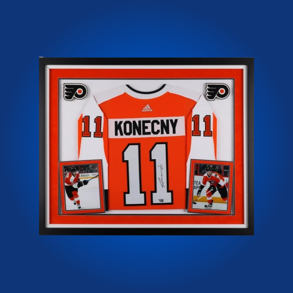 Travis Konecny’s full framed Philadelphia Flyers orange jersey, personally autographed, is a highlight for fans, celebrating the energetic forward’s passion and scoring ability.