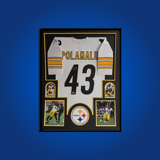 Autographed Pittsburgh Steelers custom jersey by Troy Polamalu with Certificate of Authenticity.