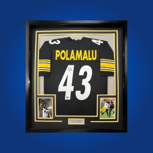 Autographed Pittsburgh Steelers custom jersey by Troy Polamalu with Certificate of Authenticity.