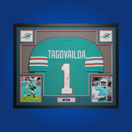 Framed Miami Dolphins custom jersey autographed by Tua Tagovailoa with Certificate of Authenticity.