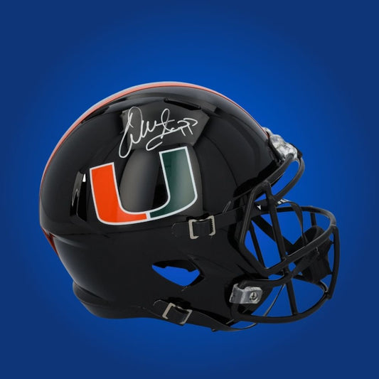 Warren Sapp hand-signed Miami Hurricanes blackout replica helmet, showcasing signature and official team graphics. A unique collectible for Miami fans and Sapp memorabilia collectors. Includes Certificate of Authenticity. Images may differ for catalog uniformity.