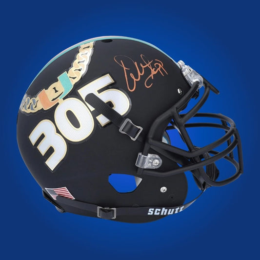 Autographed Miami Hurricanes full size Authentic Helmet signed by Warren Sapp, presented on a white backdrop for clarity. SportsMarkets memorabilia image.